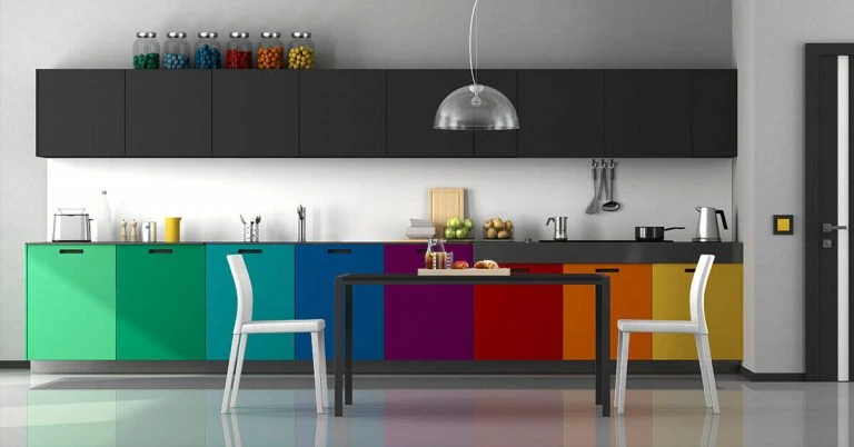 Colorful kitchen with black cupboards and table